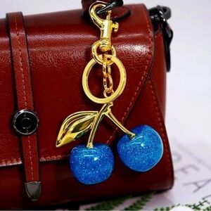 Cherry Keychain with Blue Glitter and Gold Accents